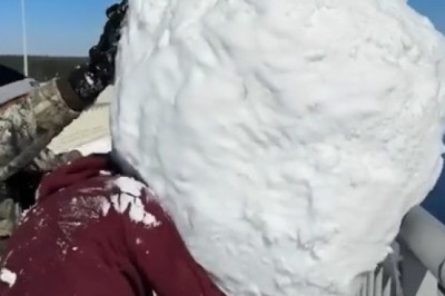 Watch a Massive Snow Block Plunge into the Water from a Bridge!